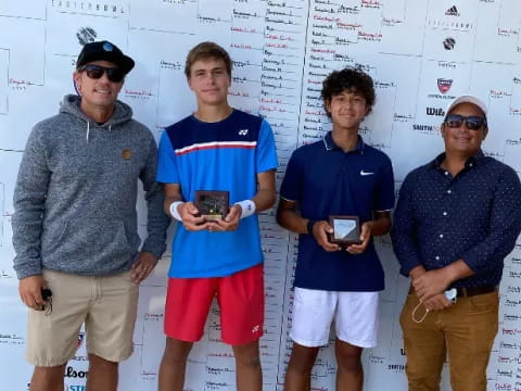 a group of men posing for a photo