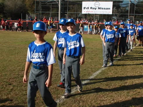 a group of kids in blue uniforms