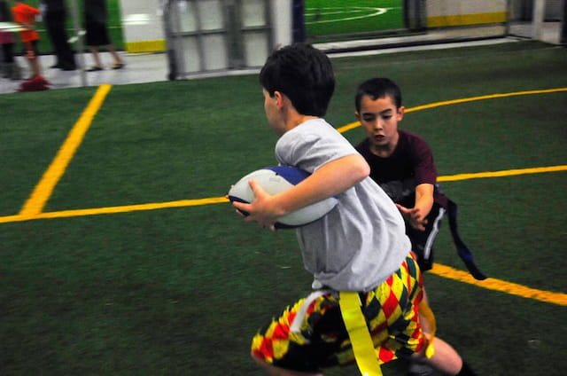 a person holding a boy