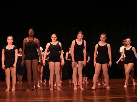 a group of women on a stage