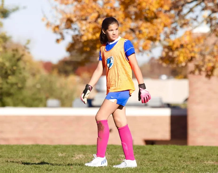 a girl in a yellow shirt