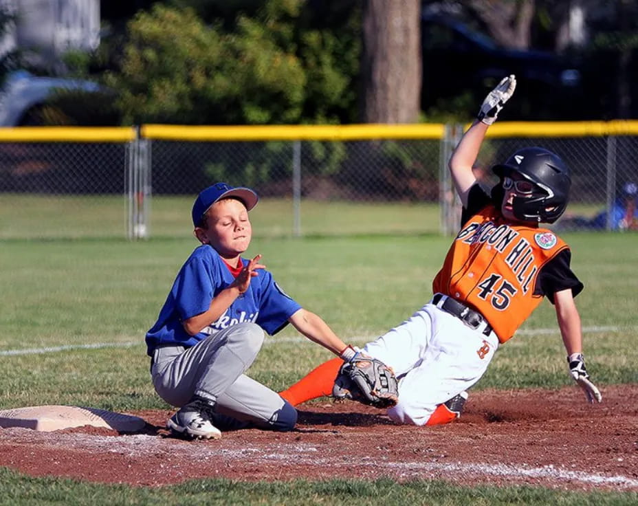 a couple of kids playing baseball