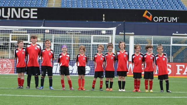 a group of football players posing for a photo