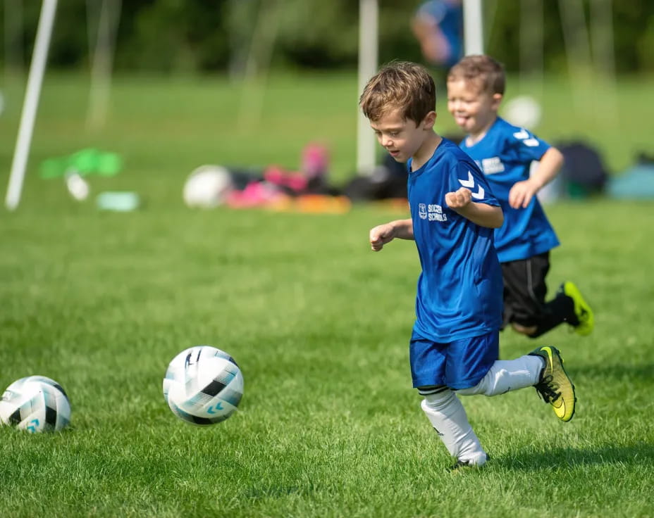 kids playing football on a field