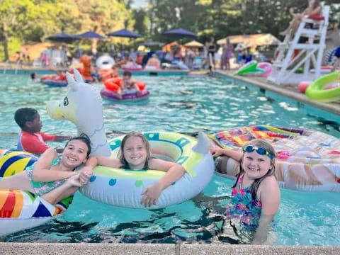 a group of kids in a pool