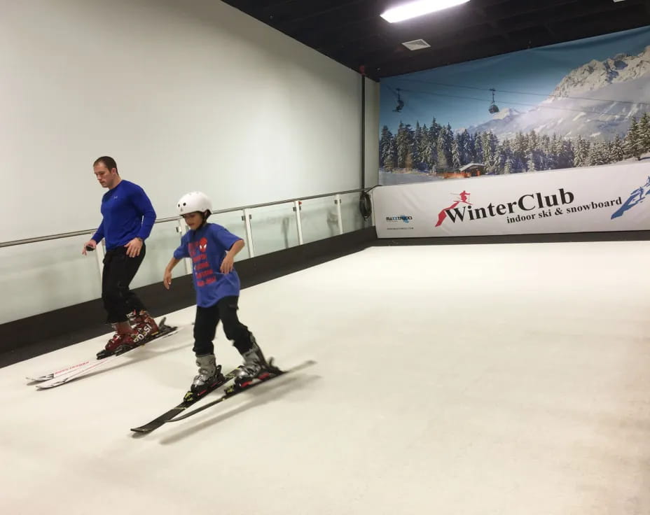 a man and a boy skiing
