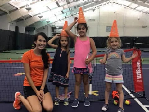 a group of girls wearing cone hats