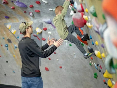 a person climbing a rock wall