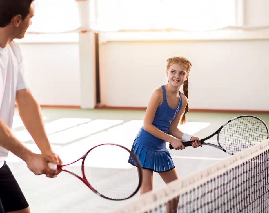 a person holding a tennis racket