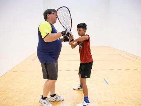 a couple of men playing tennis