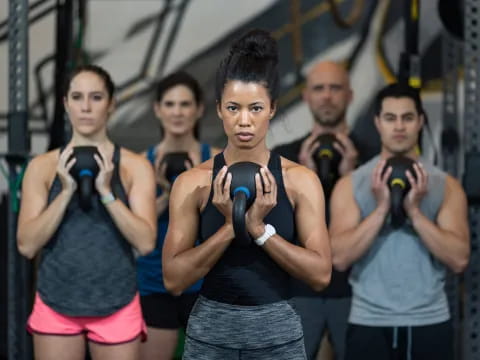 a group of people in workout gear