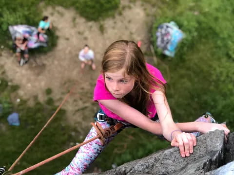 a girl lying on a rock