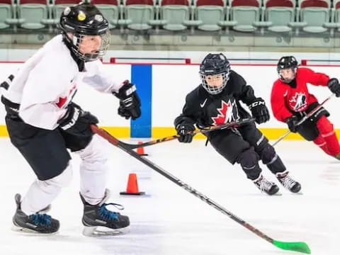 a group of people playing hockey