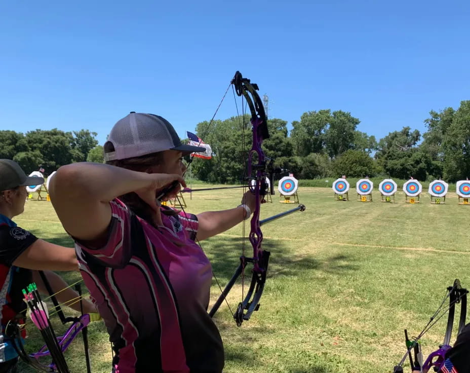 a person playing a bow and arrow