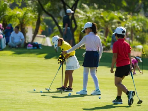 a group of people playing golf