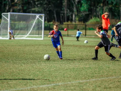kids playing football on a field