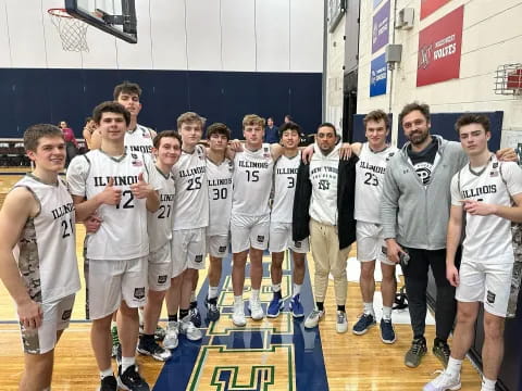 a group of boys in white uniforms