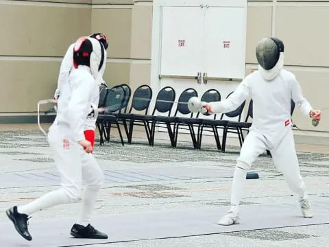 two people in white uniforms