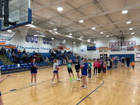 a group of people in a gym