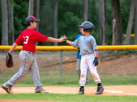 a couple of kids playing baseball