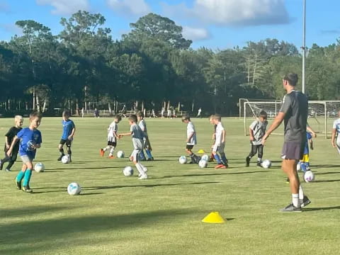 a group of kids playing football