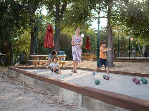 a person and children playing in a playground