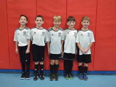 a group of boys in white shirts