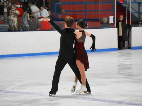 a man and woman ice skating
