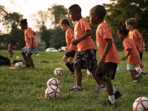 a group of kids playing football