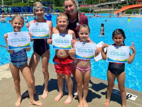 a group of children holding signs
