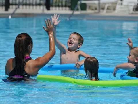 a group of kids in a pool