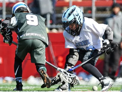 a couple of men playing hockey