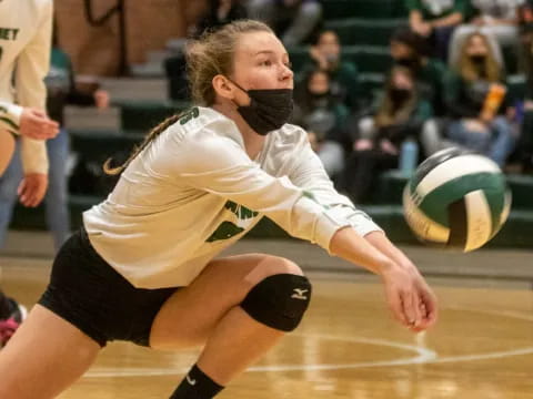 a woman playing volleyball