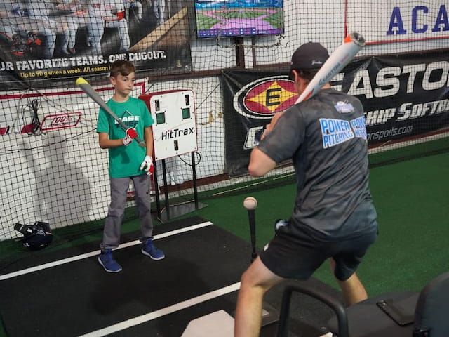 a person holding a baseball bat