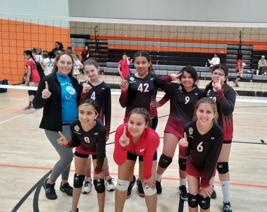 a group of girls on a court