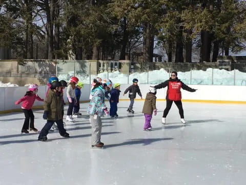 a group of people ice skating