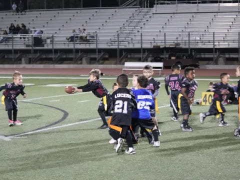 a group of kids playing football