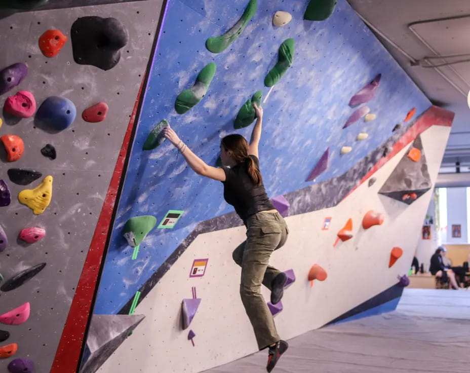 a person climbing a rock wall