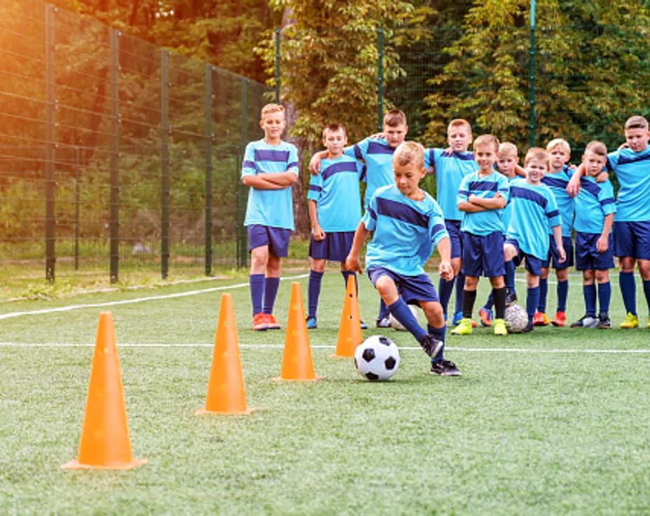 a group of kids playing football