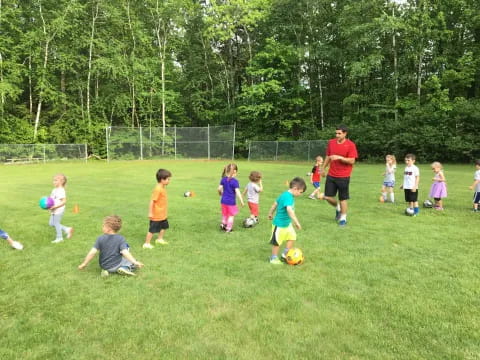 a group of kids playing football