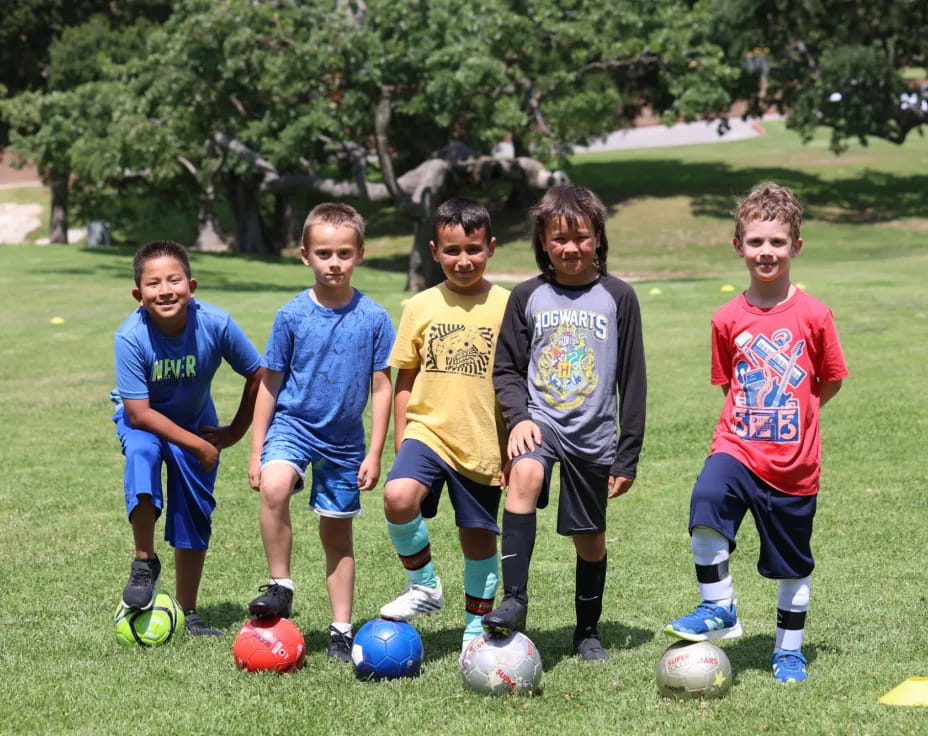 a group of boys playing football