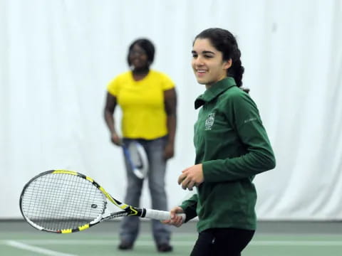 a person holding a tennis racket
