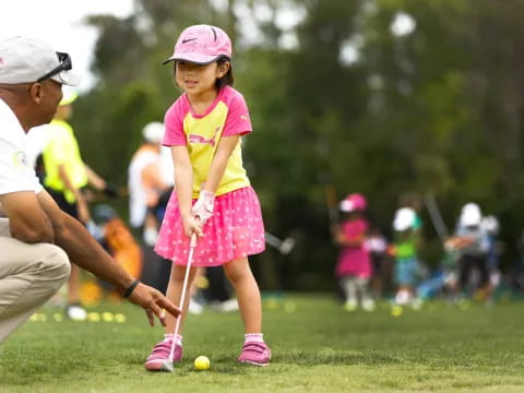 a girl playing golf