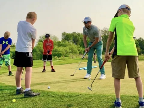 a group of people playing golf