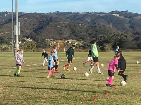 a group of kids playing football