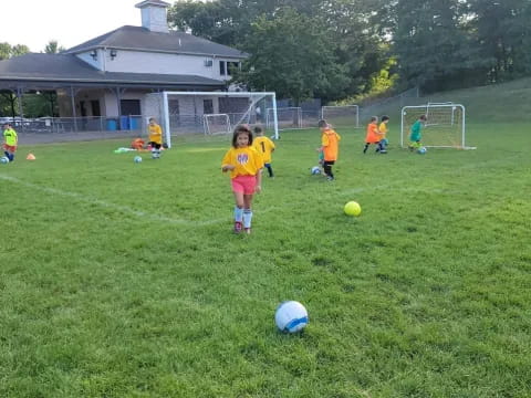 kids playing football on a field
