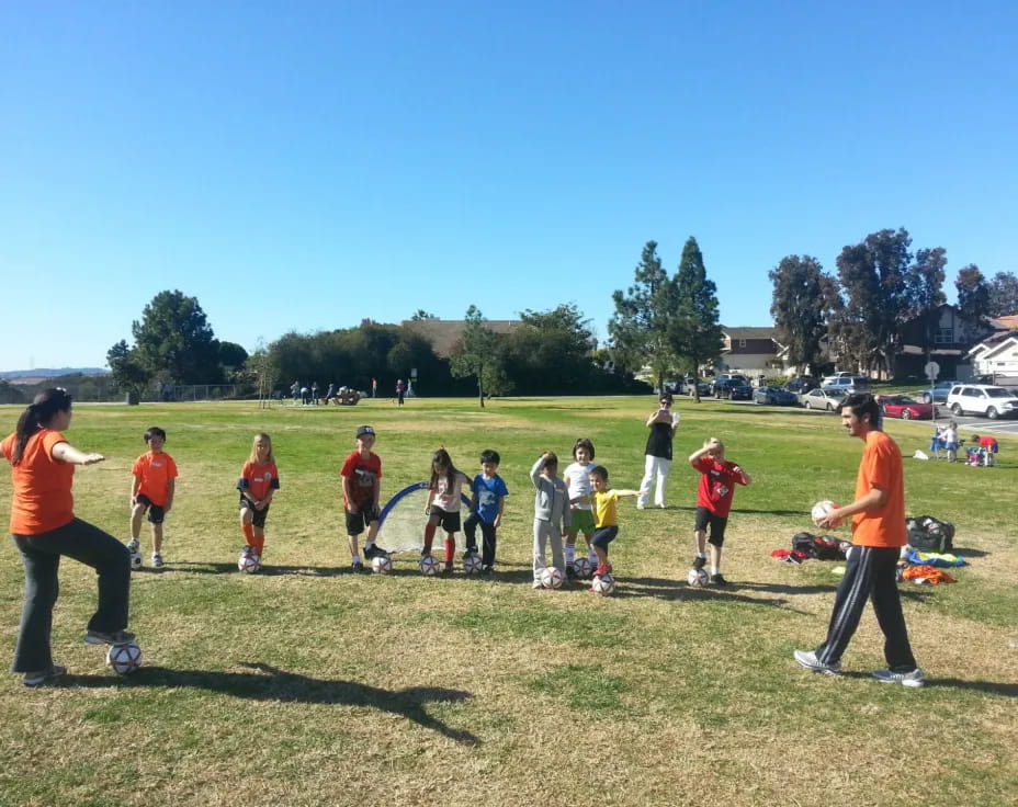 a group of kids playing football