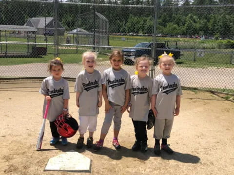 a group of kids pose for a picture