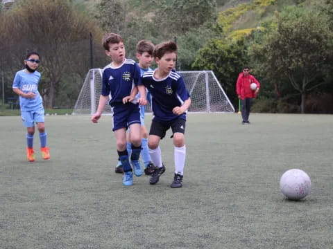 kids playing football on a field