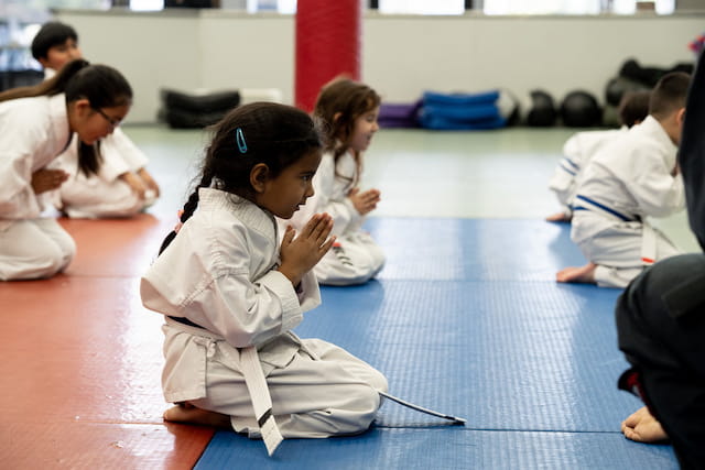 a group of people sitting on the floor